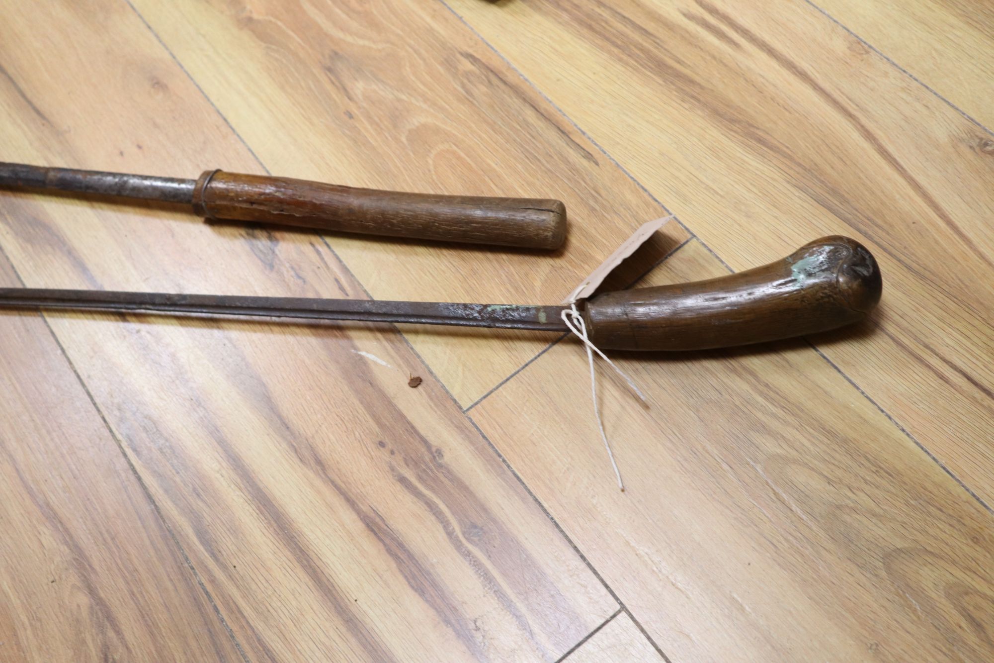 Two bamboo sword sticks, longest 94cm
